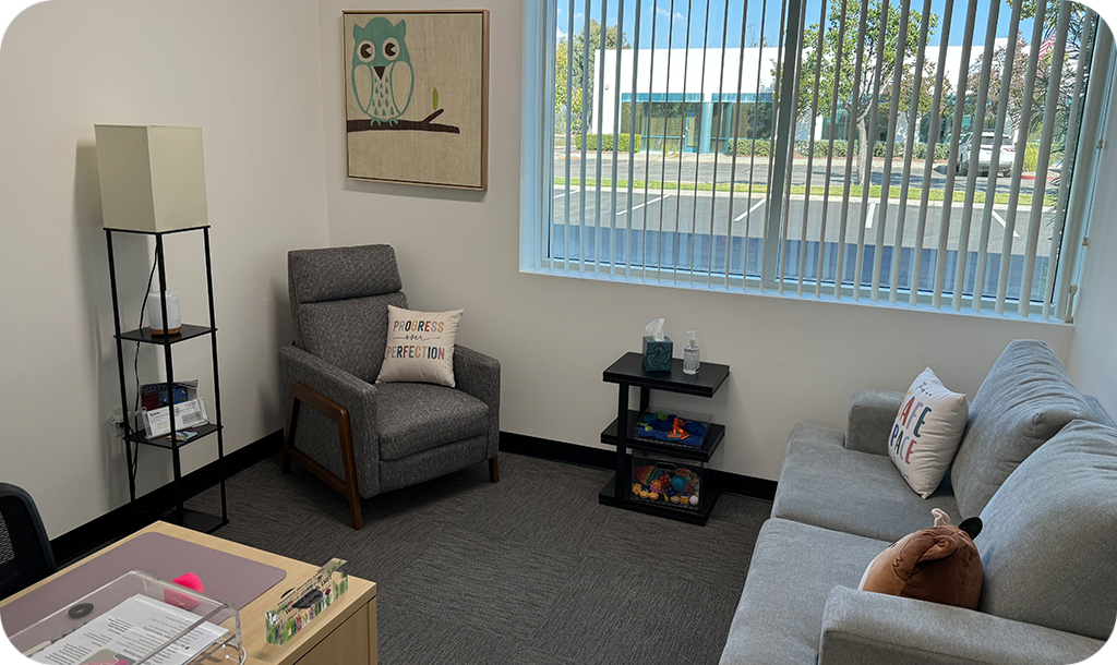 Temecula office facing out a window with owl painting.