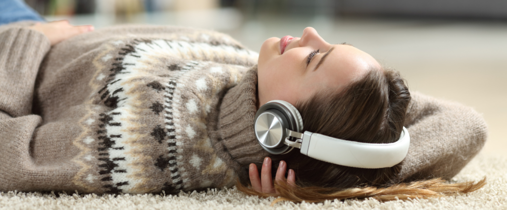 Teen lying down with headphones