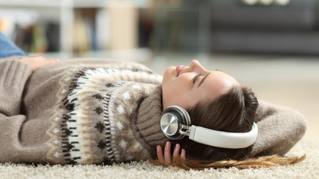 Teen lying down with headphones