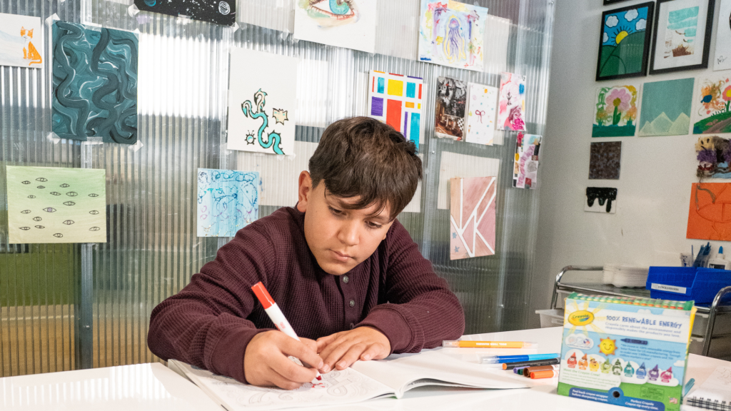 boy coloring at a mental health clinic